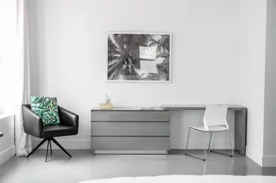 a desk and a chair in a white room at The Netherland 2A I Ocean Drive I MIAMI BEACH OCEAN RENTAL in Miami Beach