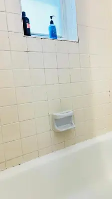 a bathroom with a soap holder on a tiled wall at Apt 202 Near Cruise Port, 5 Min to Downtown, 4 Min to Trains, 14Min to Airp in Miami