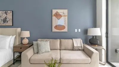 a living room with a couch and a bed at The Bayfront VIII in Miami