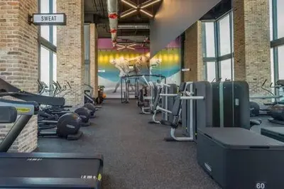 a gym with treadmills and exercise equipment in a building at The Bayfront VIII in Miami