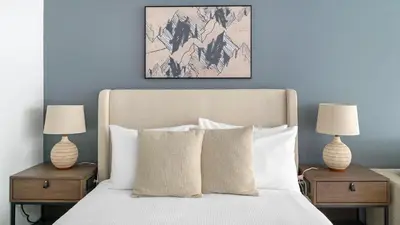 a bedroom with a bed with two tables with lamps at The Bayfront VIII in Miami