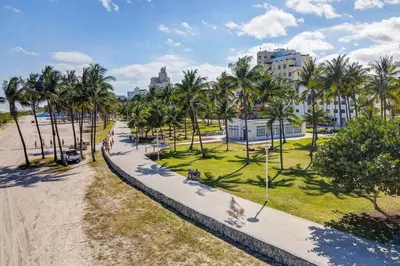 an aerial view of a park with palm trees and a sidewalk at Easy Ocean Dr Beach, 2 Queenbeds in Miami Beach