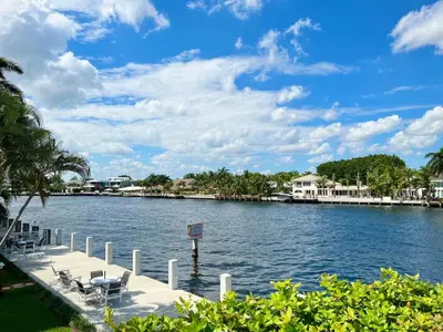 a large body of water with chairs and condos at Renovated Intercoastal 2Bdrm 1 bath condo Walk to Beach in Fort Lauderdale