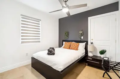 a bedroom with a bed with a teddy bear on it at 6-BD 3-BA Dreamy Vacation Retreat in Coral Terrace in Miami