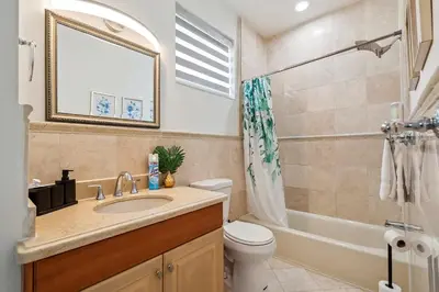 a bathroom with a sink and a tub and a toilet at 6-BD 3-BA Dreamy Vacation Retreat in Coral Terrace in Miami