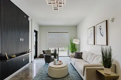 a living room with a couch and a table at Prime 2BR Near FLL Airport, Dania Beach & Pointe in Fort Lauderdale