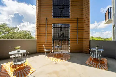two chairs and a table on a patio at Prime 2BR Near FLL Airport, Dania Beach & Pointe in Fort Lauderdale
