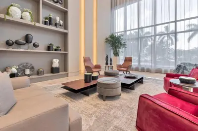 a living room with red furniture and a large window at Wonderful 1 bedroom Apartment in Downtown Doral in Miami