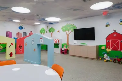 a childrens room with a play room with a wall mural at Wonderful Studio Apartment in Downtown Doral in Miami
