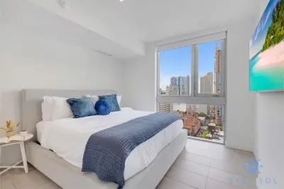a bedroom with a large bed with a large window at Best Stay Gym Bar and Spa in Miami