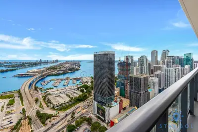 a view of a city from a balcony at Luxury Apartment 3 Bedrooms Pool Gym Views & More in Miami
