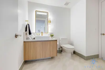 a bathroom with a sink and a toilet at Luxury 2 Bedrooms Balcony Pool & Gym in Miami