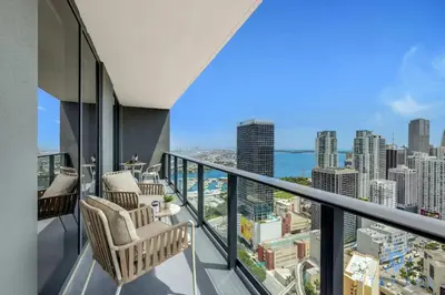 a balcony with chairs and a view of the city at Luxury 2 Bedrooms Balcony Pool & Gym in Miami