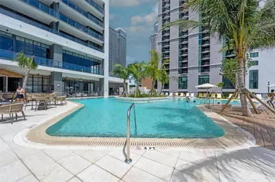 a swimming pool in the middle of a building at Modern Apartment 2BR-2BTH- Pool & Gym in Miami