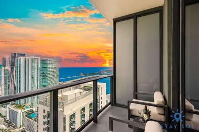 a balcony with a view of the ocean at Chic Downtown - City Views Gym & Pool in Miami