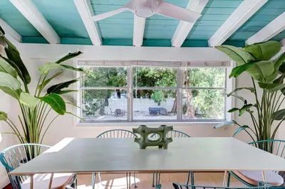 a dining room with a table and plants at Luxury Home in Brickell Miami, 5 min to the Beach! in Miami