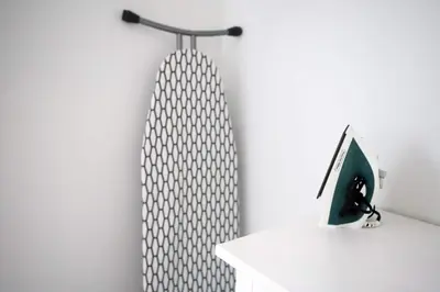 a shower curtain on a wall next to a desk at Family Friendly Condo Steps to Miami Beach with Free Parking in Miami Beach