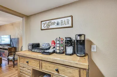 a table with a coffee and bar sign on a wall at 11 Mi to South Beach Home with Screened Porch! in Miami