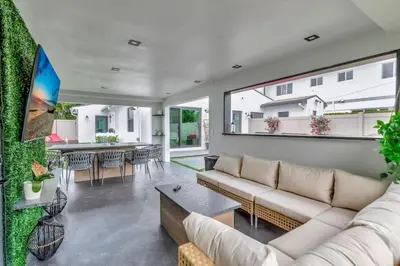 a living room with a couch and a table at Contemporary 3BR 3 BA Duplex, Amazing Outdoor Area in Fort Lauderdale