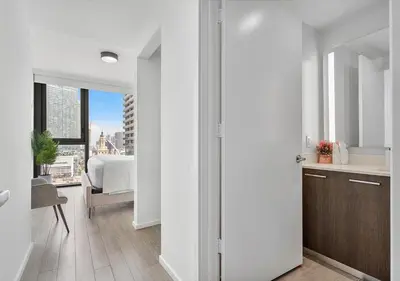 a room with a kitchen and a bedroom with a bed at X Lounge II-Highline Corner Residence in Miami