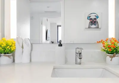 a white bathroom with a sink and a mirror at X Lounge II-Highline Corner Residence in Miami
