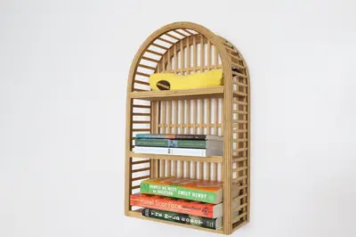 a bamboo book shelf with books on it at Ocean Drive South Beach Miami in Miami Beach