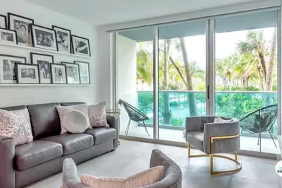 a living room with a couch and a chair at Beach home 1Bed/1.5Bath w/King bed at Sian in Hollywood