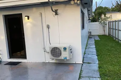 a house with a air conditioner on the side of it at Spacious Private Room Close to Miami Attractions in Miami