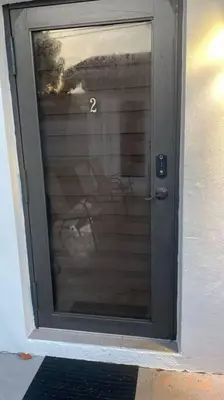 a glass door with the number two on it at Spacious Private Room Close to Miami Attractions in Miami