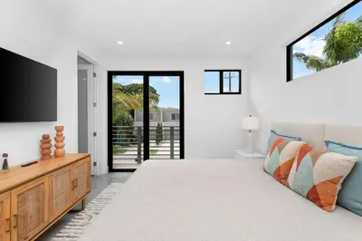 a bedroom with a bed and a flat screen tv at Beautiful Property in Fort Laurderdale in Fort Lauderdale