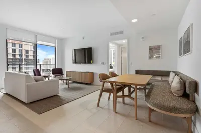 a living room with a couch and a table at Bayside Breeze - Downtown Luxury Tower in Miami