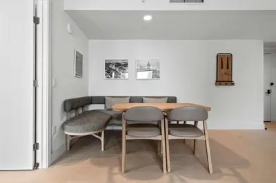 a dining room with a table and two chairs at Bayside Breeze - Downtown Luxury Tower in Miami