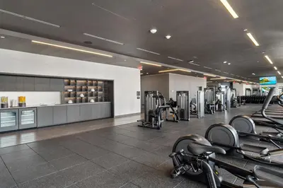 a gym with treadmills and elliptical machines at NEW Luxurious Apartment Floor 35th - Miami's heart in Miami