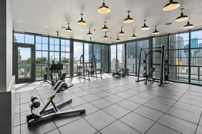 a gym with treadmills and exercise equipment in a building at NEW Luxurious Apartment Floor 35th - Miami's heart in Miami