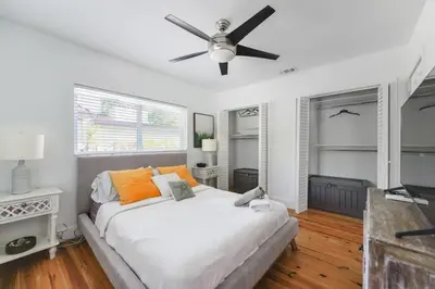 a bedroom with a bed and a ceiling fan at Charming House with Private Pool n Coral Gable in Miami