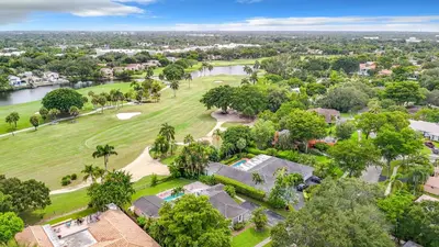 an aerial view of a house with a golf course at Emerald Hills Haven in Hollywood