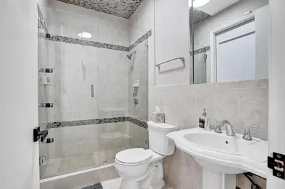 a bathroom with a toilet and a sink and a shower at Spacious Luxury Villa in Hollywood 6BR 5-Bath 5-Min Walk to Beach & Attractions in Hollywood