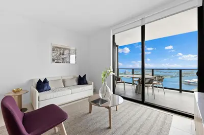 a living room with a couch and a table at Lux Downtown Miami w Free Parking in Miami