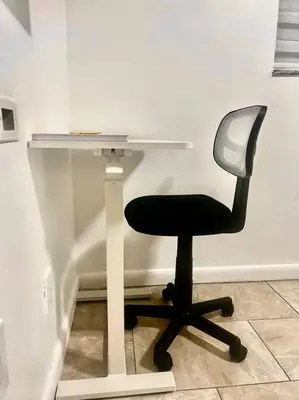 a desk with a chair next to a table at Hollywood Golden House Modern & luxurious Studio in Hollywood