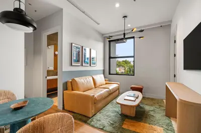 a living room with a couch and a table at The Rover Miami in Miami