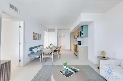 a living room with a couch and a table at Apartment 3BR-3 BTH - Gym & Pool in Miami