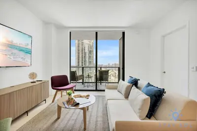 a living room with a couch and a table at Modern 1BR Apartment with Pool in Miami