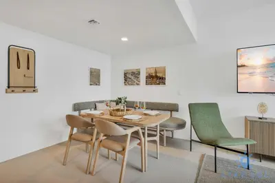 a dining room with a table and chairs at Modern 1BR Apartment with Pool in Miami