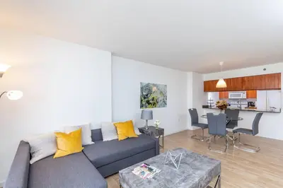a living room with a couch and a table at Spacious 29th Floor 1 BED 1 BTH Brickell Ocean View in Miami
