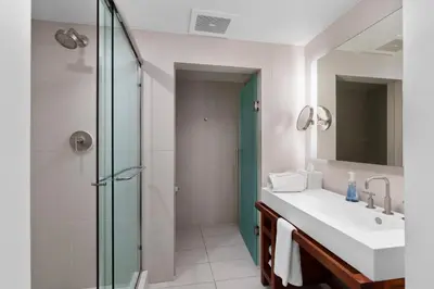 a bathroom with a sink and a glass shower at 2BR W Residence FLL, OCEAN VIEWS, Infinity pool, hot tub, large balcony, easy amentiy access in Fort Lauderdale