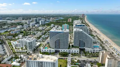 an aerial view of a beach and buildings at 2BR W Residence FLL, OCEAN VIEWS, Infinity pool, hot tub, large balcony, easy amentiy access in Fort Lauderdale