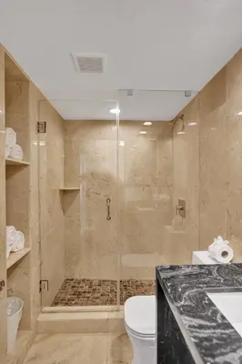 a bathroom with a shower and a toilet at Luxury Ocean View Condo Resort Amenities 501 in Miami Beach