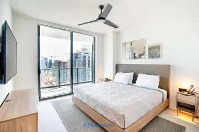 a bedroom with a bed and a large window at Apartment in New Luxury Condo in Downtown in Miami