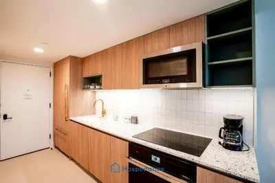 a kitchen with a sink and a microwave at Apartment in New Luxury Condo in Downtown in Miami