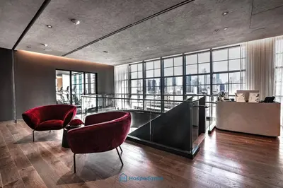 a lobby with two chairs and a slide in a building at Apartment in New Luxury Condo in Downtown in Miami